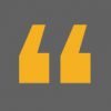 Yellow quotation marks on a dark gray background.