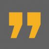 Yellow quotation marks against a dark gray background.